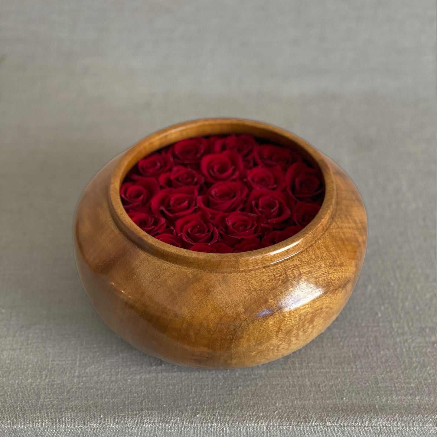 Minimalist preserved floral arrangements in artisan wooden bowls from the Hearts Honed Collection