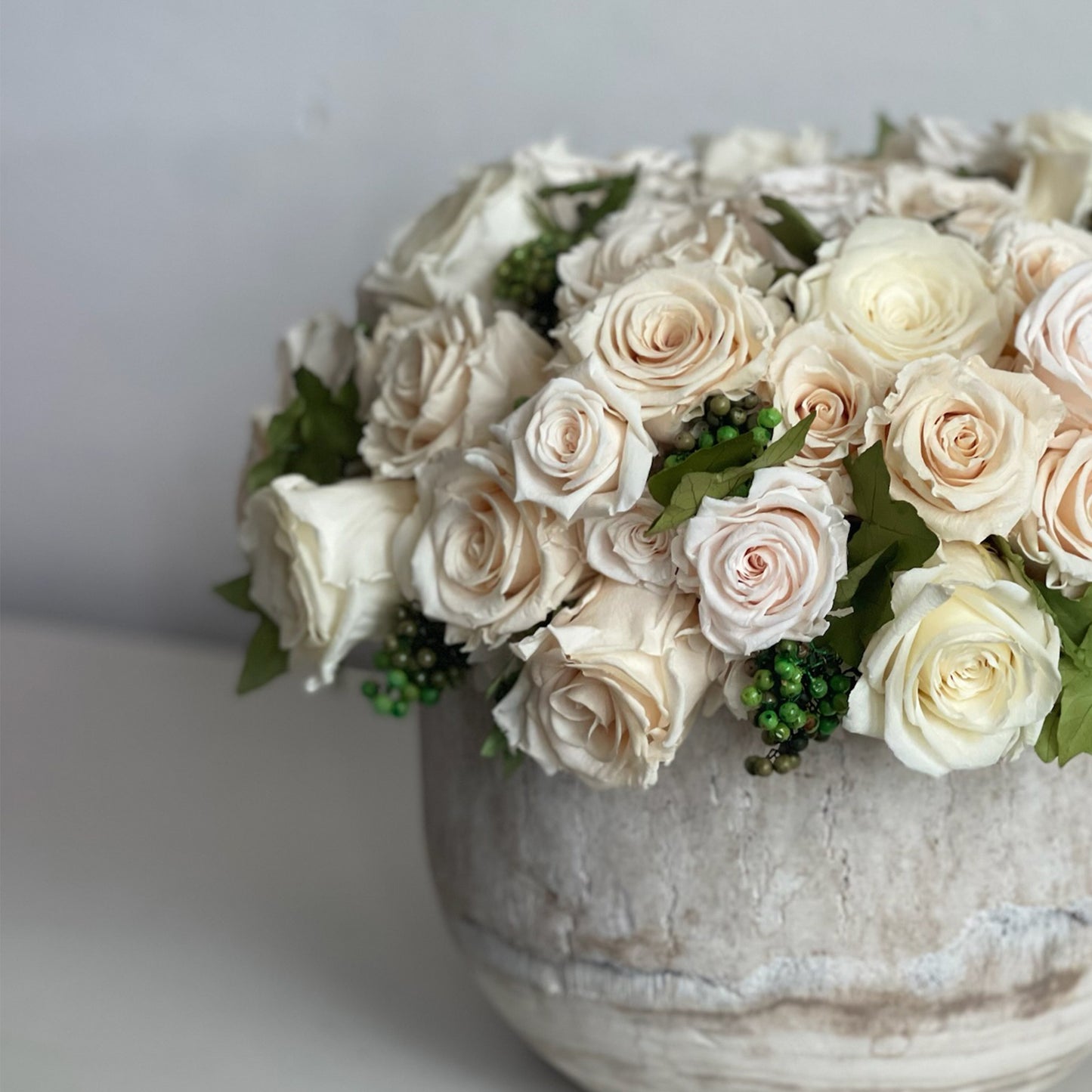 Side view of Ivy Rose showing preserved roses, ivy, and California pepperberry.