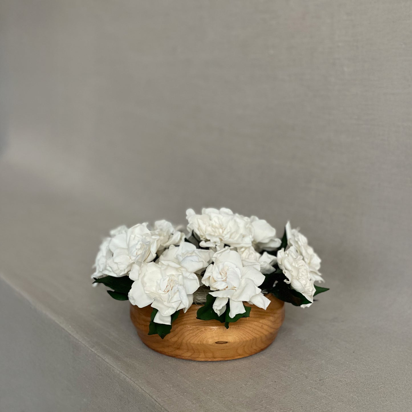 Teakwood Ivory arrangement showcasing hand-selected preserved roses in a minimalist wooden vessel