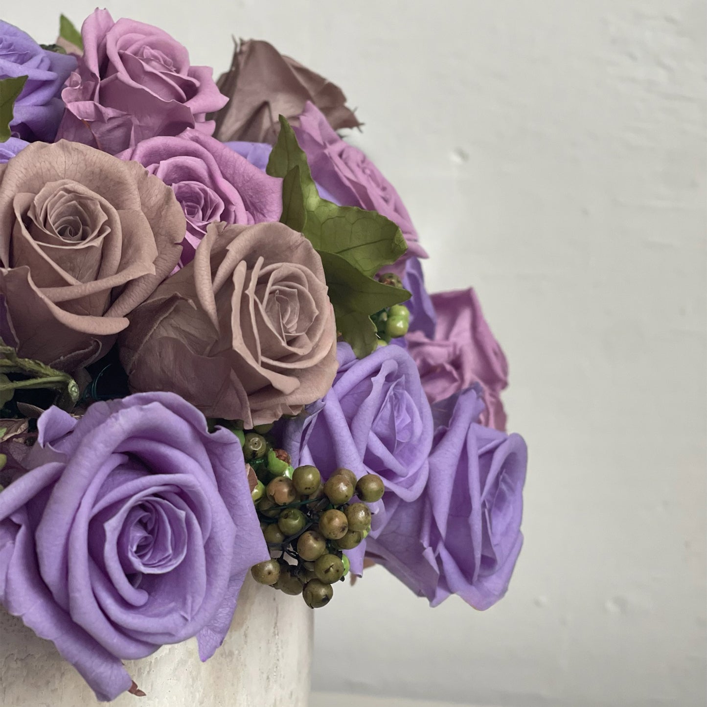 Close-up of Amethyst Cloud with preserved roses and soft whitewashed bowl