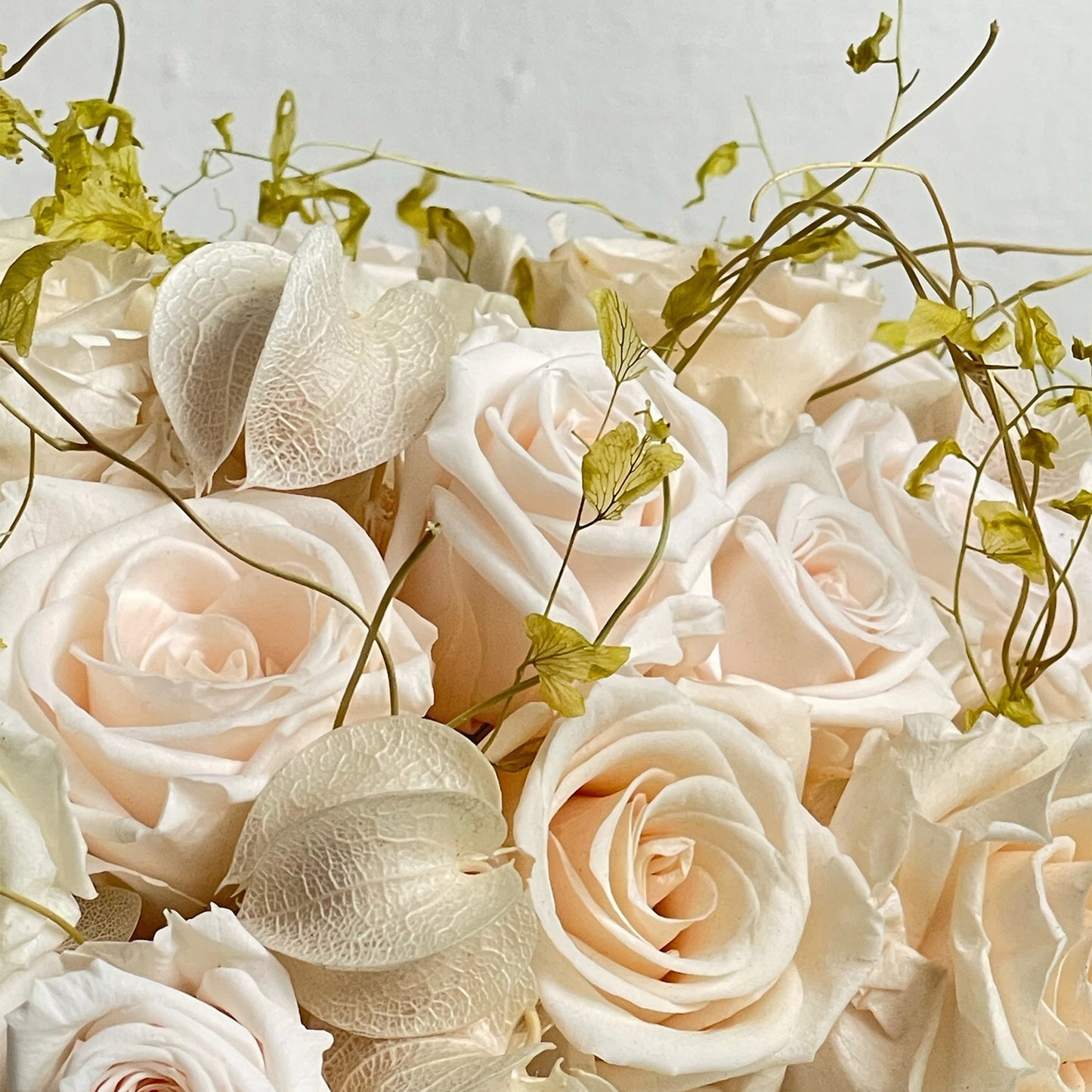 Close-up of hydrangea and preserved botanical textures in Delicate Dawn by Los Angeles Floral Company.