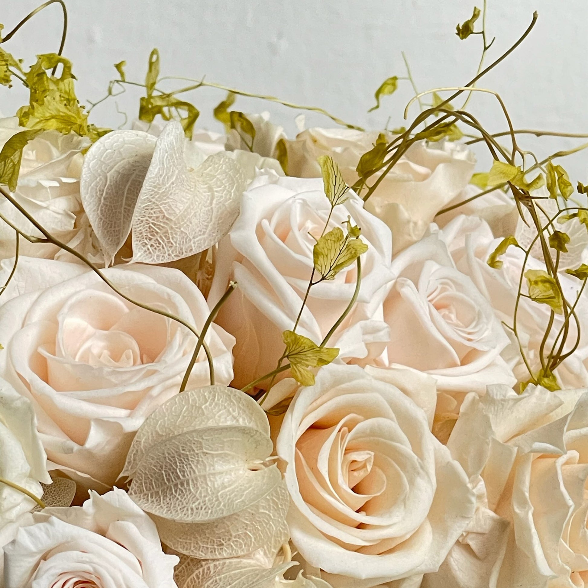 Close-up of hydrangea and preserved botanical textures in Delicate Dawn by Los Angeles Floral Company.