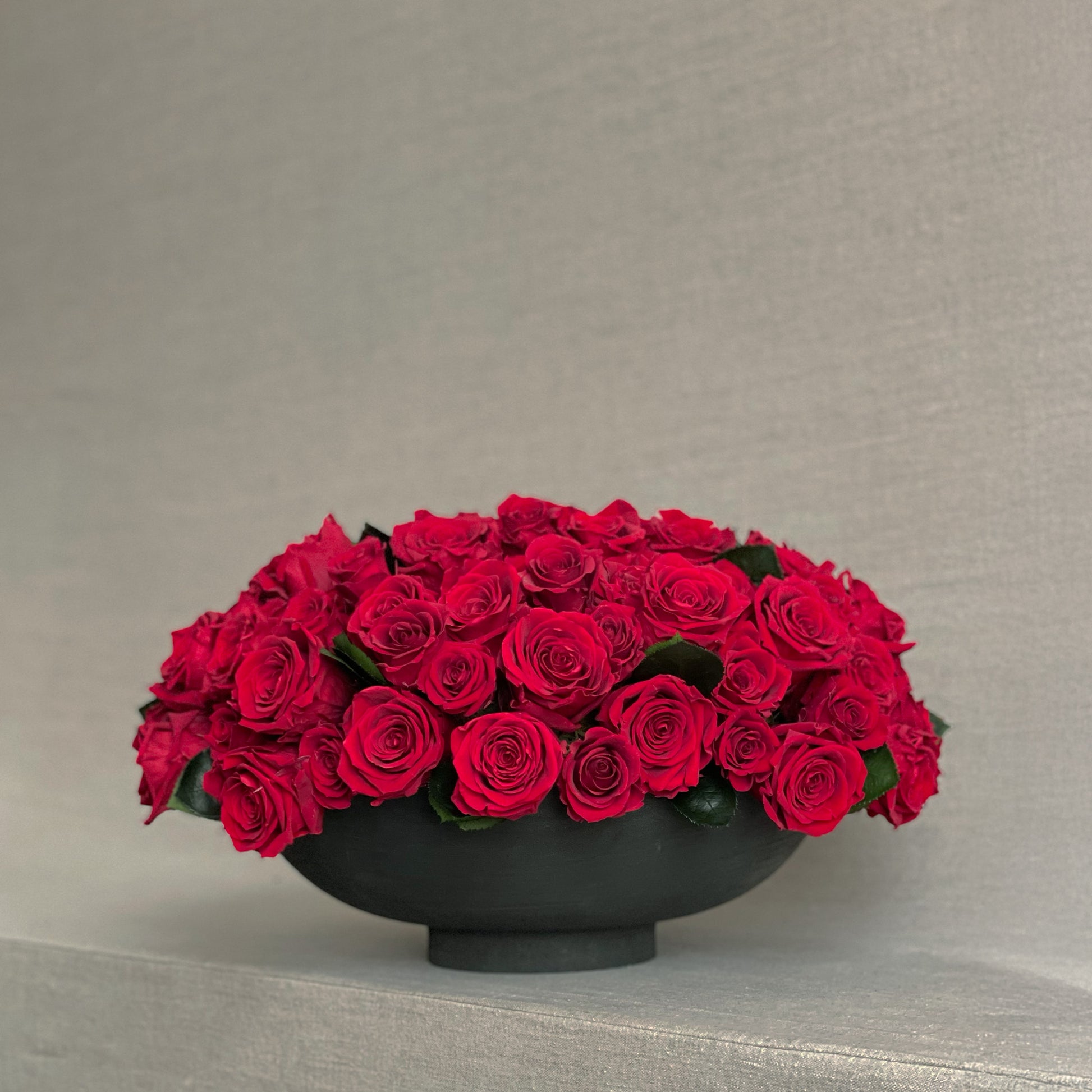 Forever Romance floral centerpiece featuring preserved red roses in a minimalist design.
