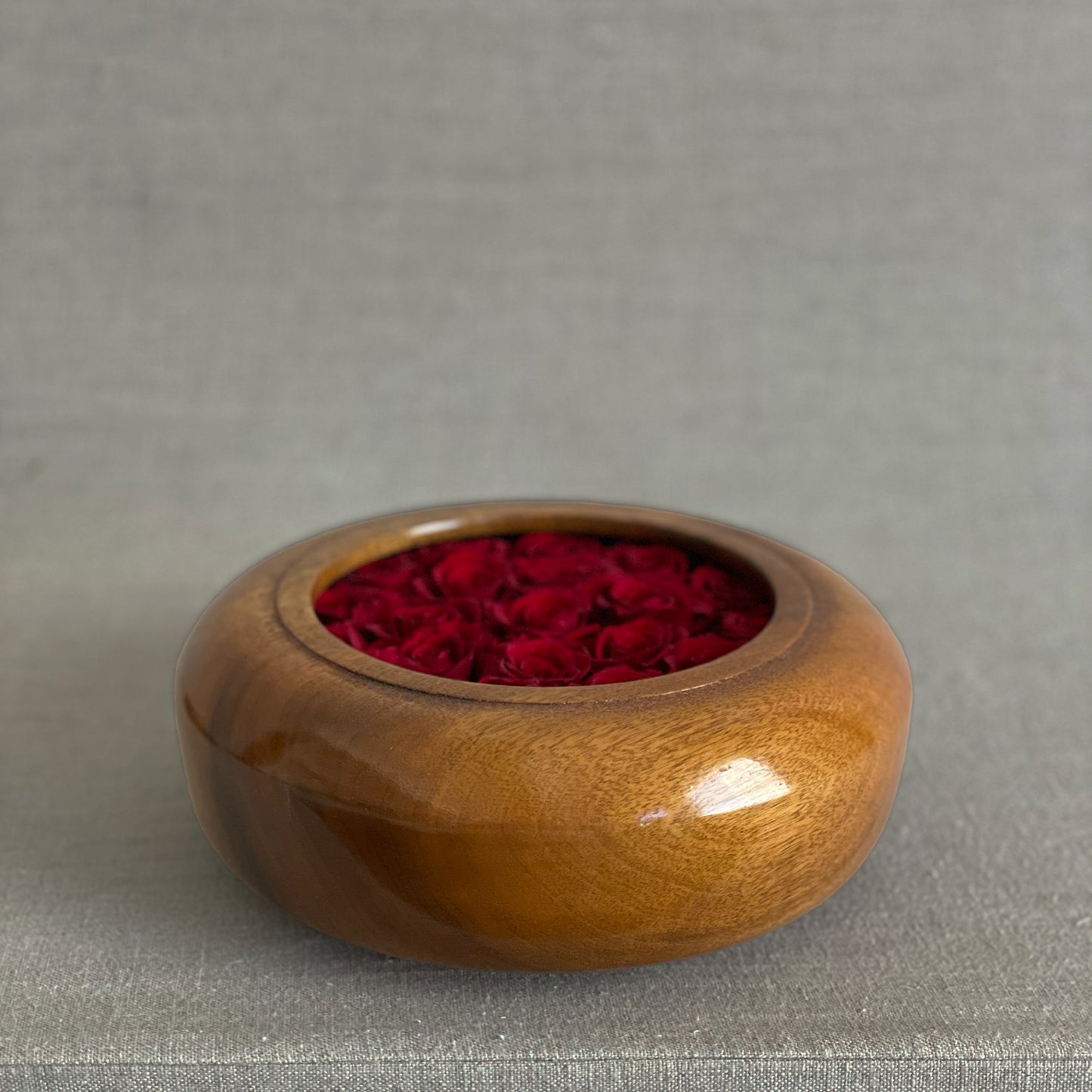 Minimalist preserved floral arrangements in artisan wooden bowls from the Hearts Honed Collection.
