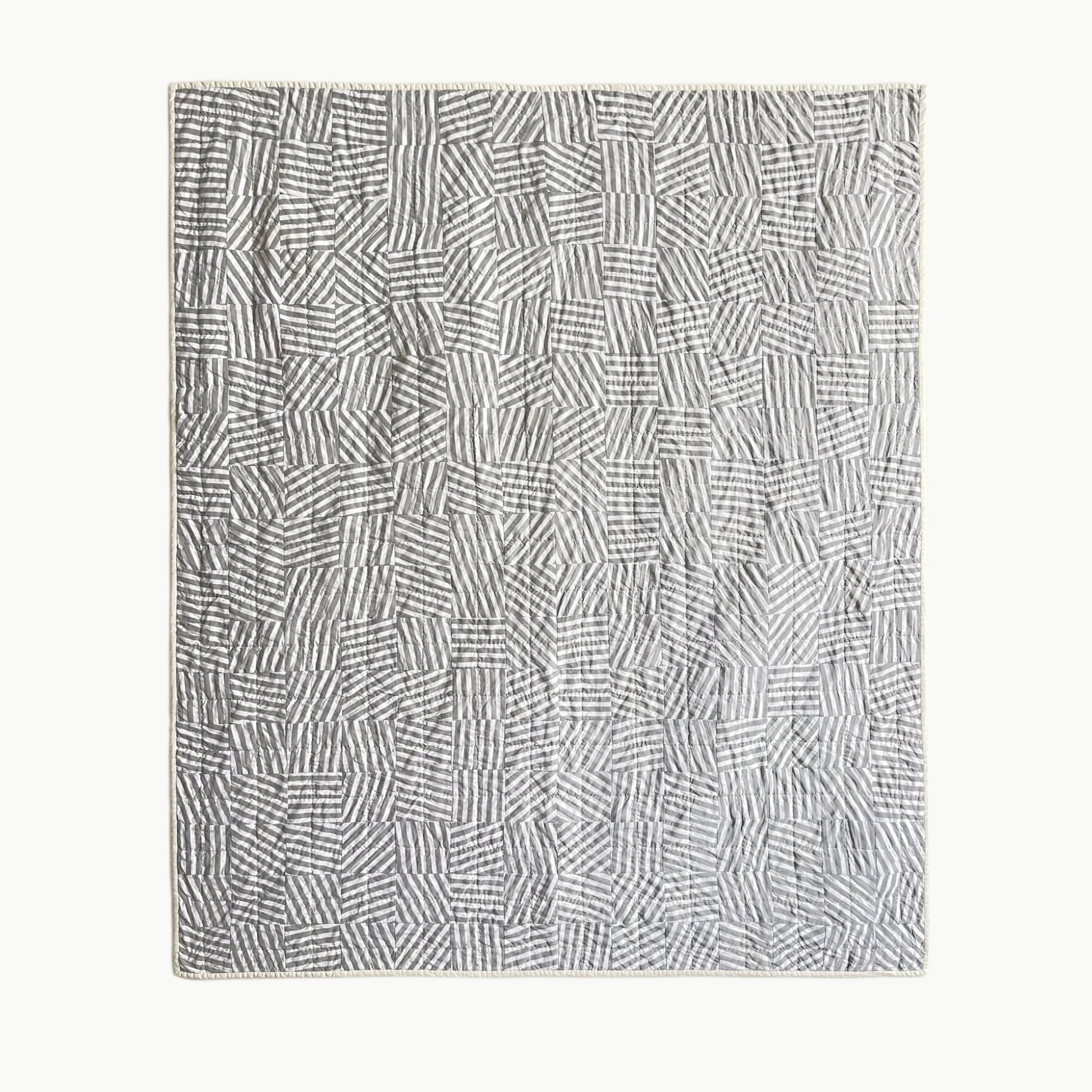  Hand-stitched ‘Stripe Study 1’ throw-size quilt by Los Angeles Floral Company, featuring a playful disruption of intersecting stripes in various directions.