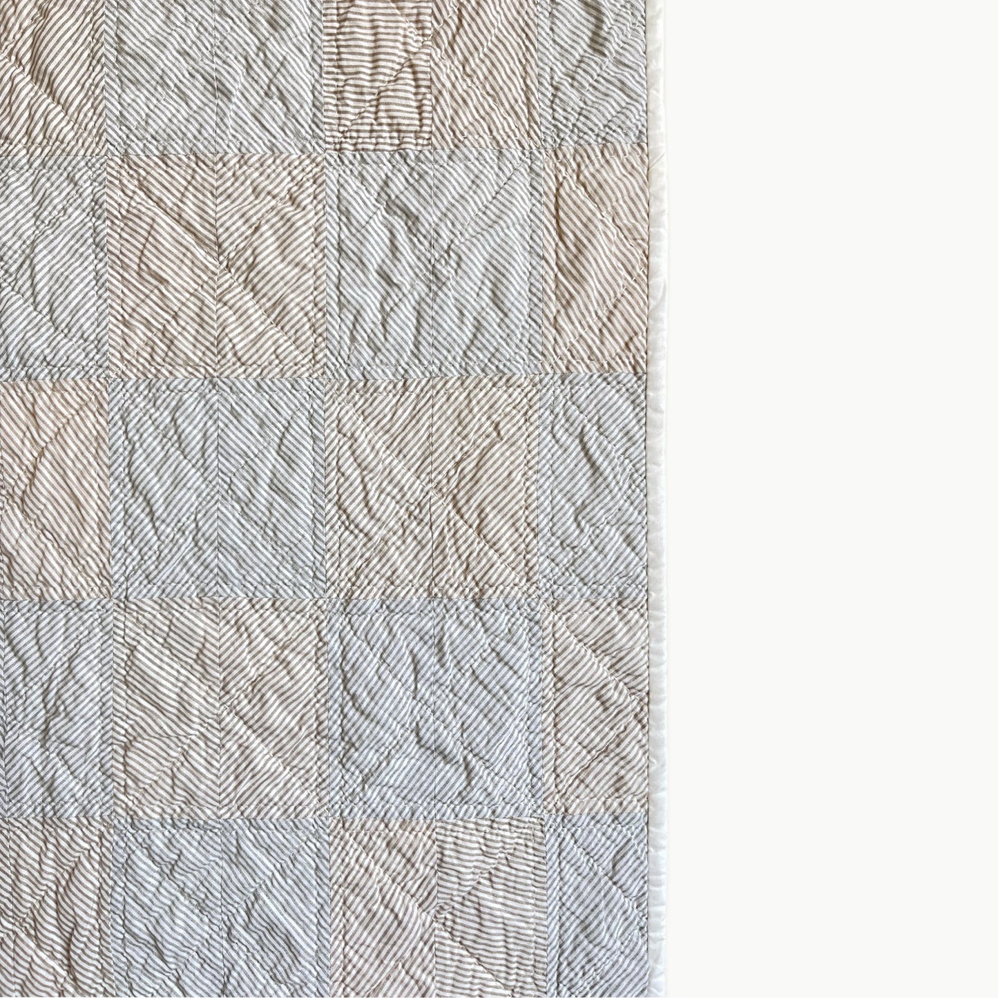 Close-up of the stripes in the ‘Stripe Study 2’ quilt by Los Angeles Floral Company, showcasing hand-stitched Sashiko-style quilting.