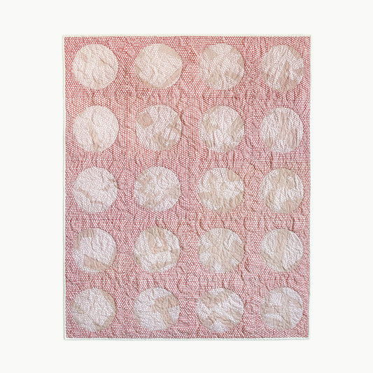 Hand-stitched ‘Yayoi’s Red Dot’ throw-size quilt by Los Angeles Floral Company, featuring large circles inspired by Yayoi Kusama’s iconic use of dots.