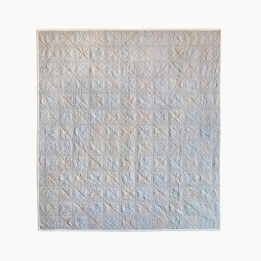 ‘Stripe Study 2’ throw-size quilt by Los Angeles Floral Company, featuring a checkerboard pattern made from striped fabric in two shades.